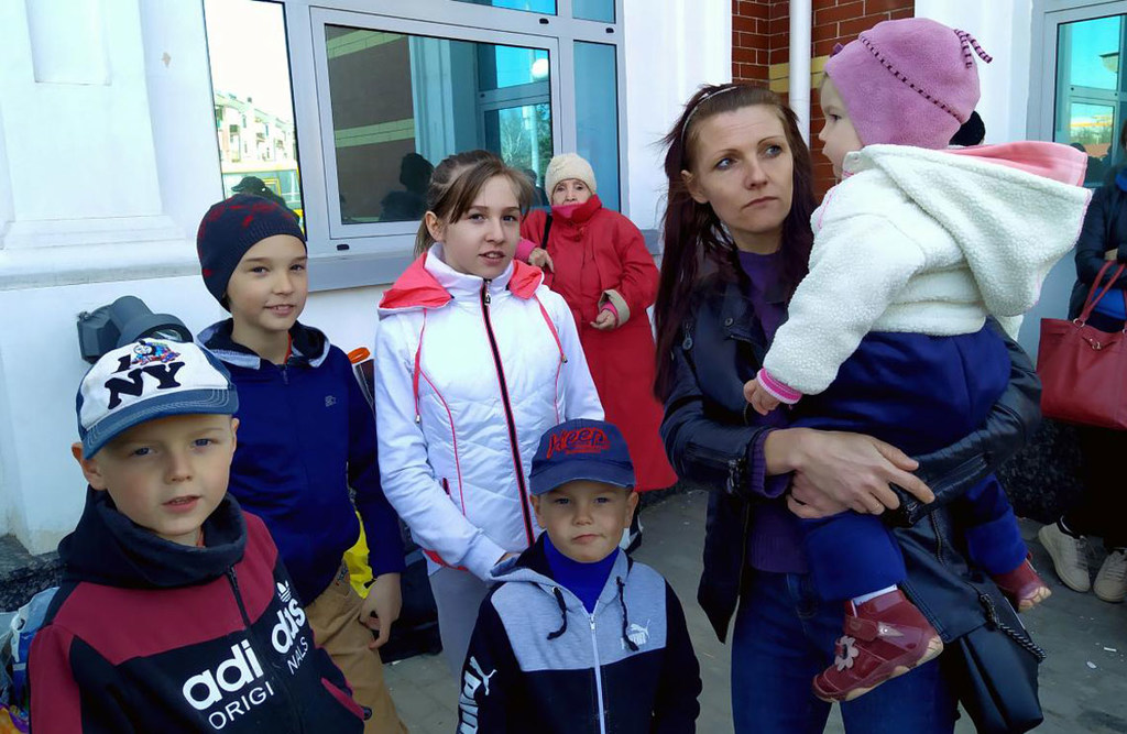 Olena and her five children wait for an evacuation train at the train station in Kramatorsk, Donetsk region of Ukraine.